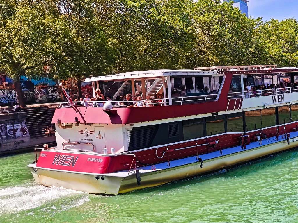 Sailing Danube River cruise Vienna city skyline view