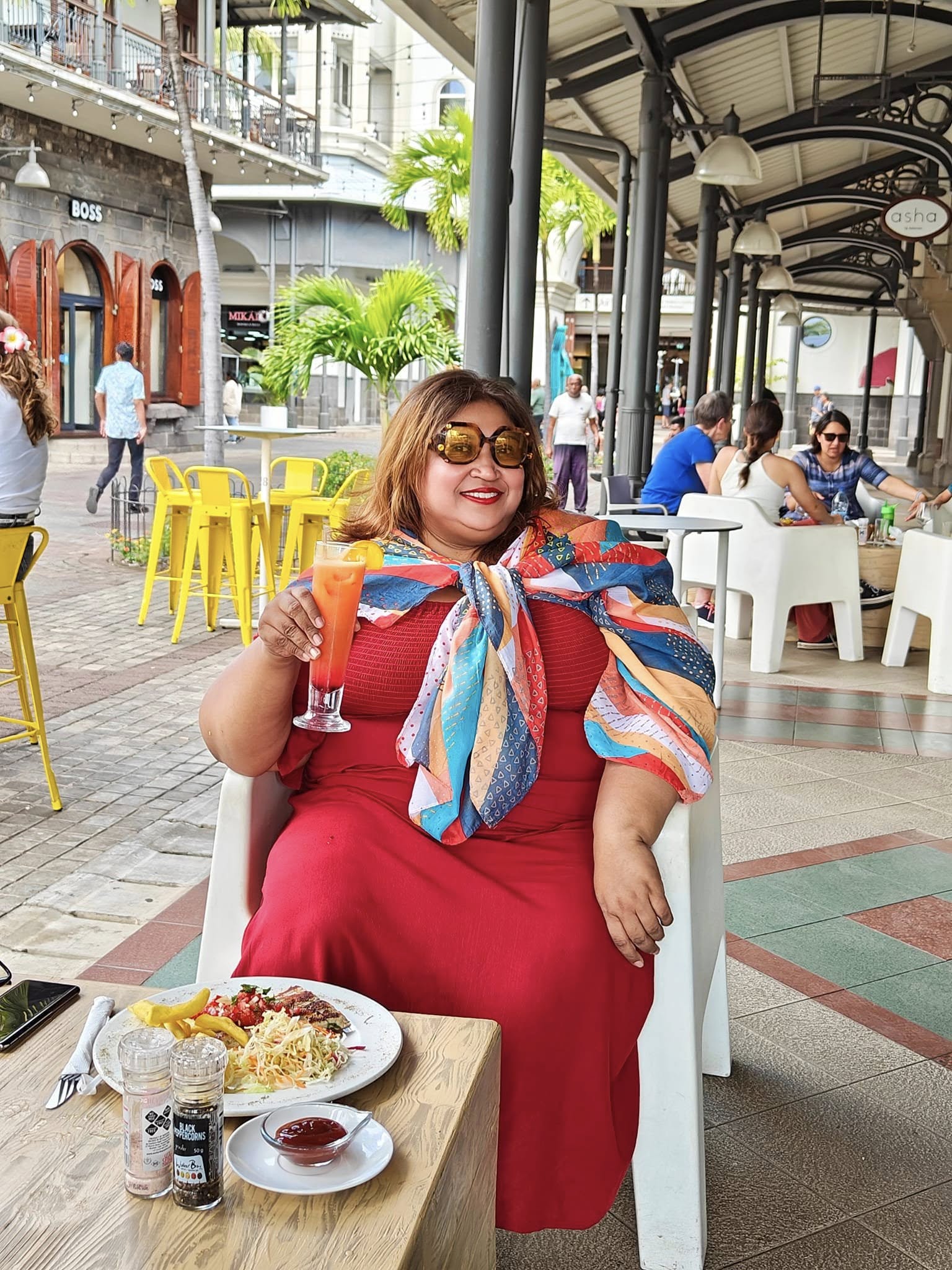 Enjoying grilled fish and chips with coleslaw at Le Caudan Waterfront Mauritius