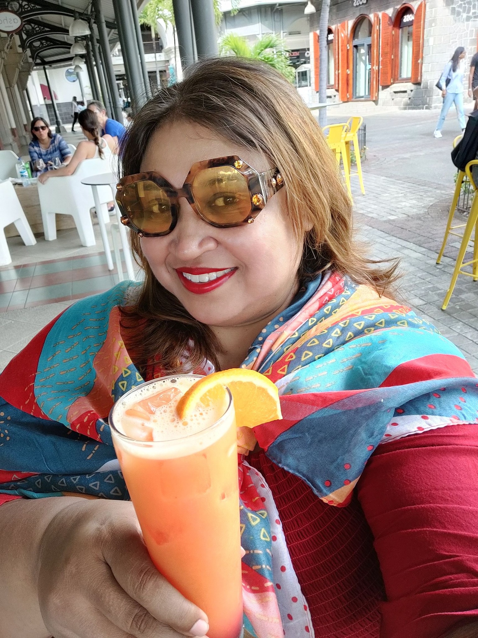 Sipping a tropical Tequila Sunrise by the waterfront
