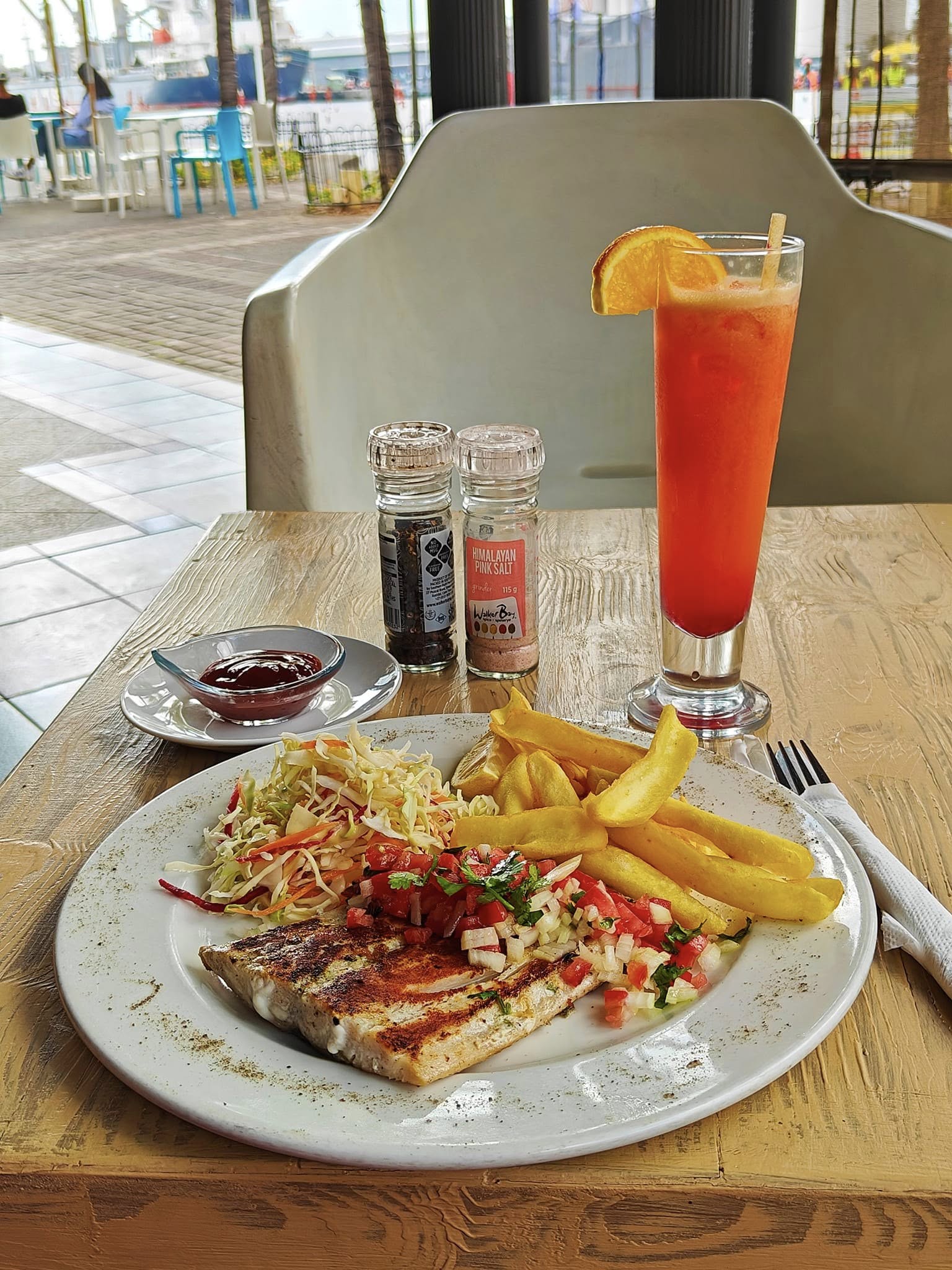 Grilled fish and chips with coleslaw at Le Caudan Waterfront Mauritius