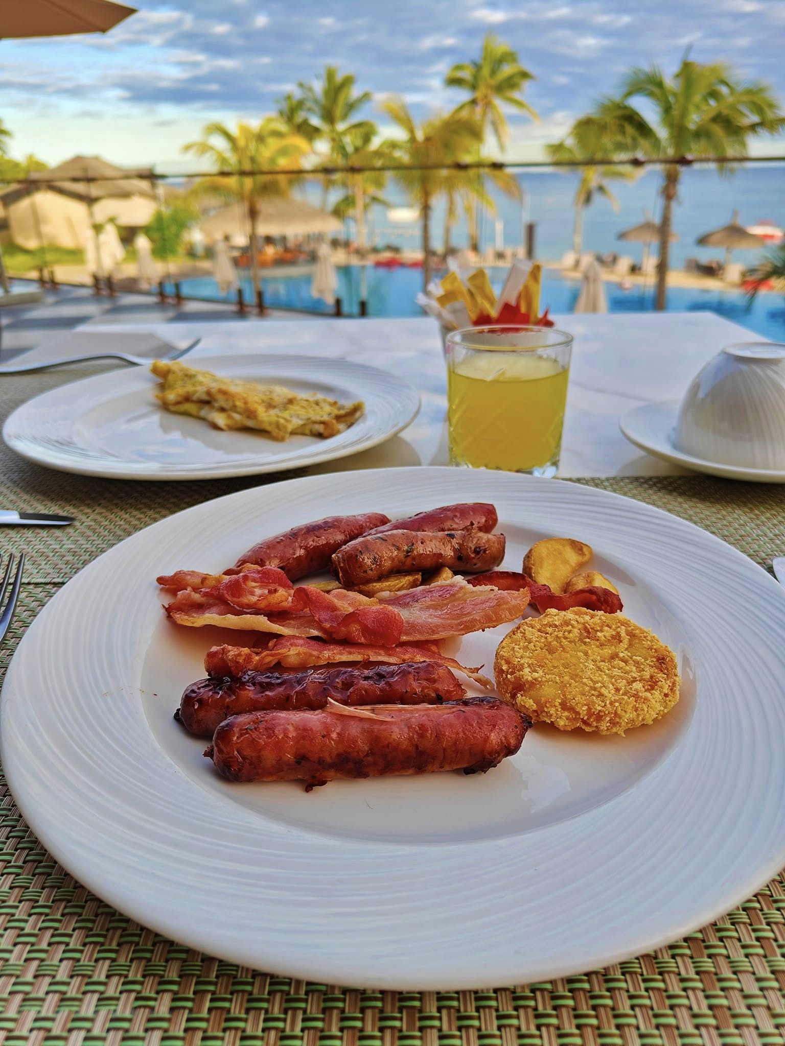 Classic English breakfast with eggs, sausages, beans, and toast