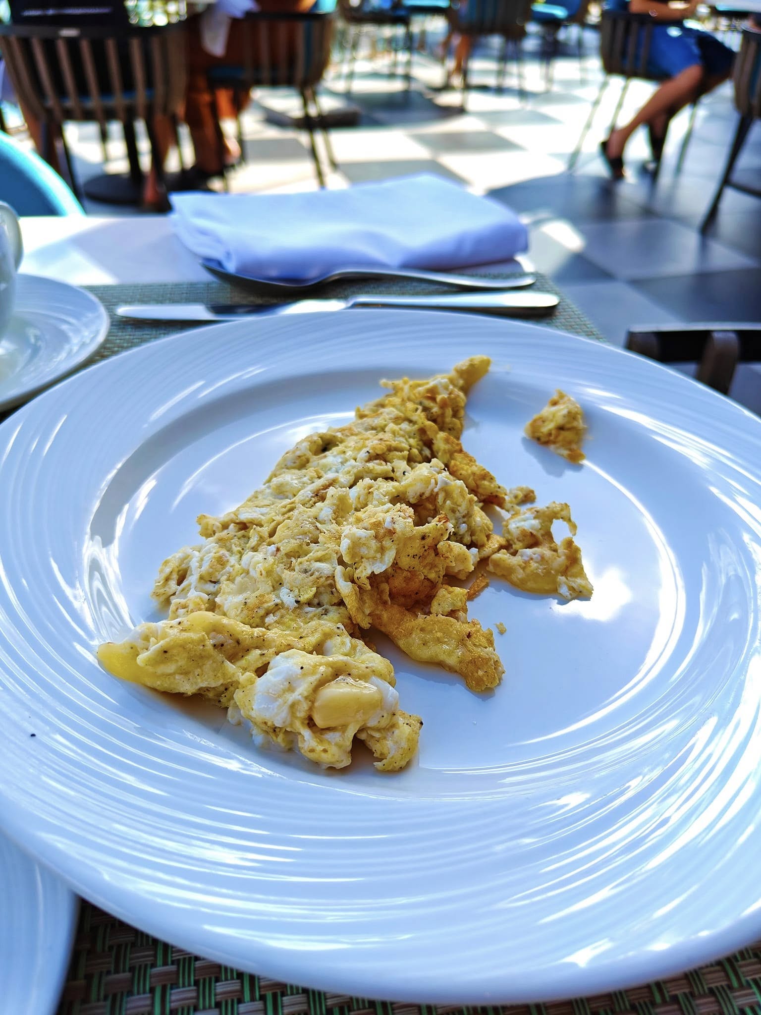 Creamy scrambled eggs served as part of a breakfast spread