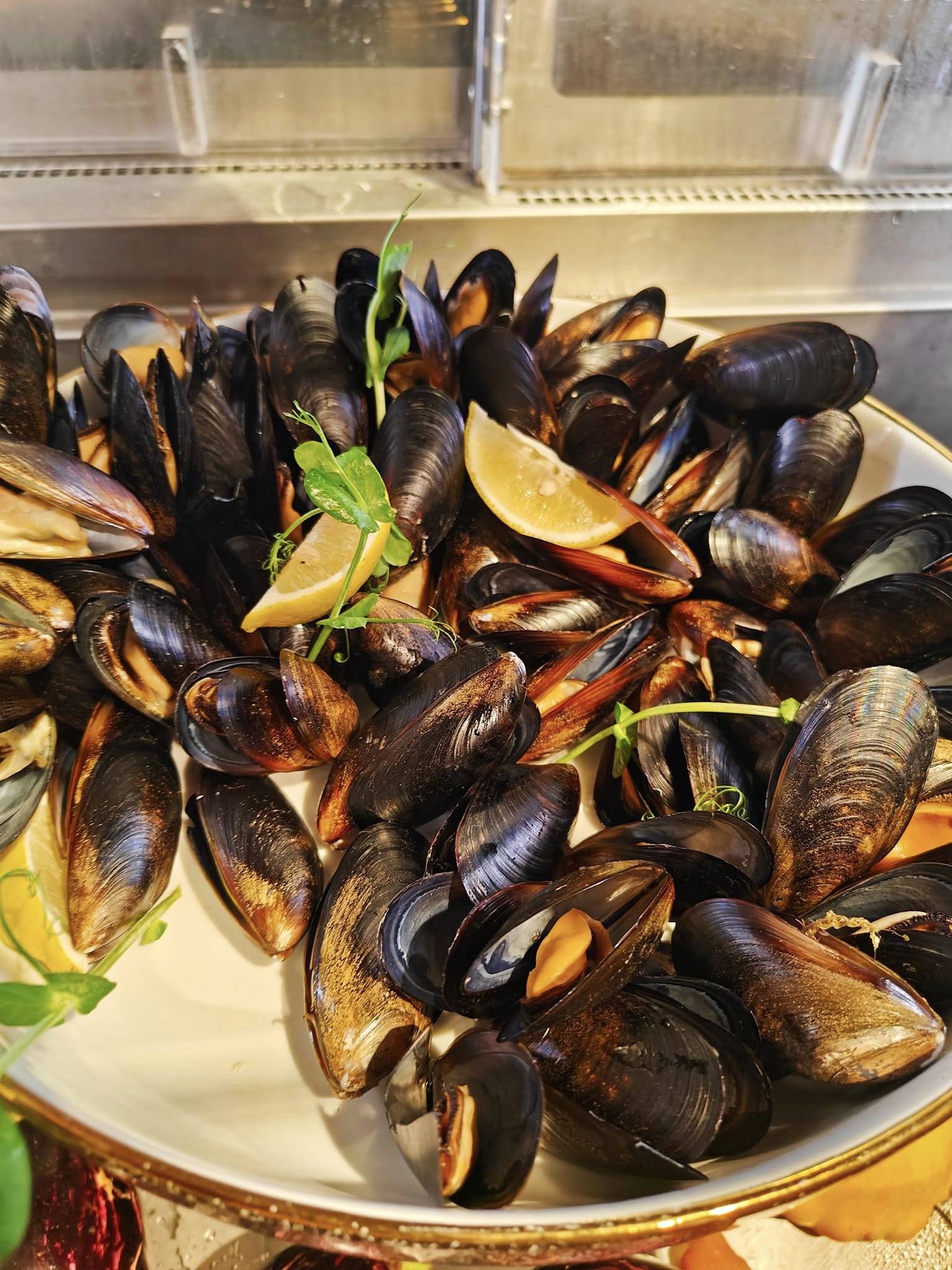 Steamed mussels served fresh with aromatic herbs
