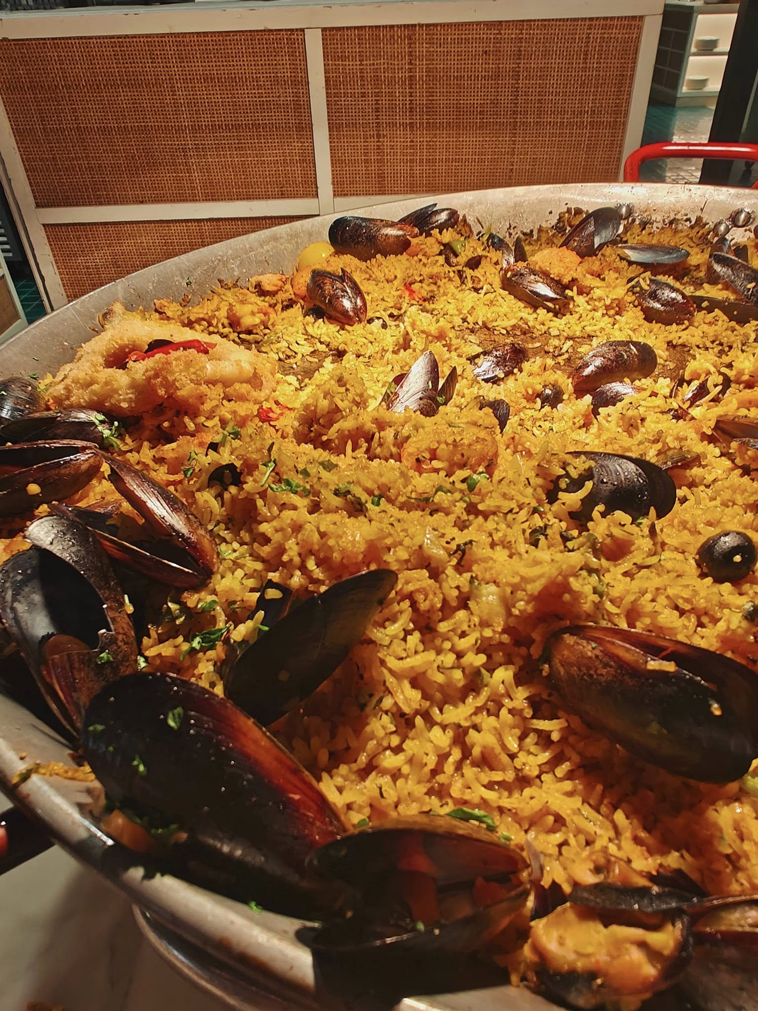 Seafood paella loaded with prawns, mussels, and saffron rice