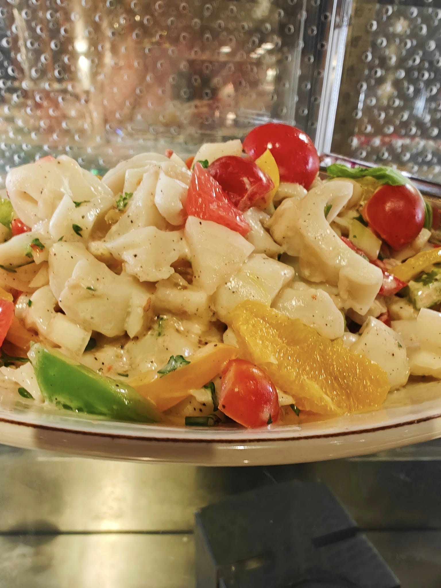 Fresh squid salad with herbs and Mediterranean flavours