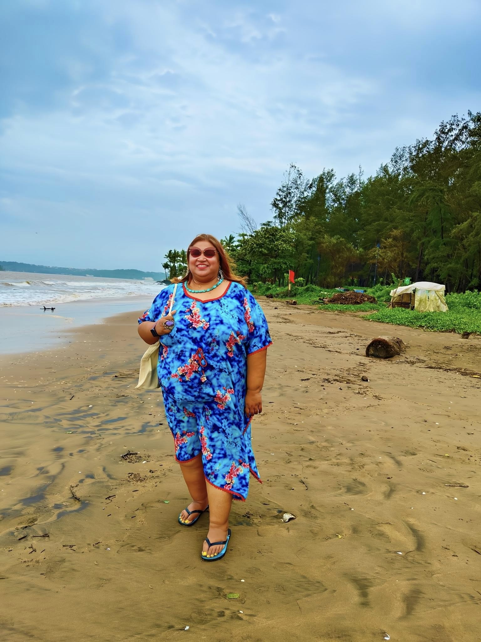 Golden sands and swaying palms at Miramar Beach, Goa, overlooking the Arabian Sea.