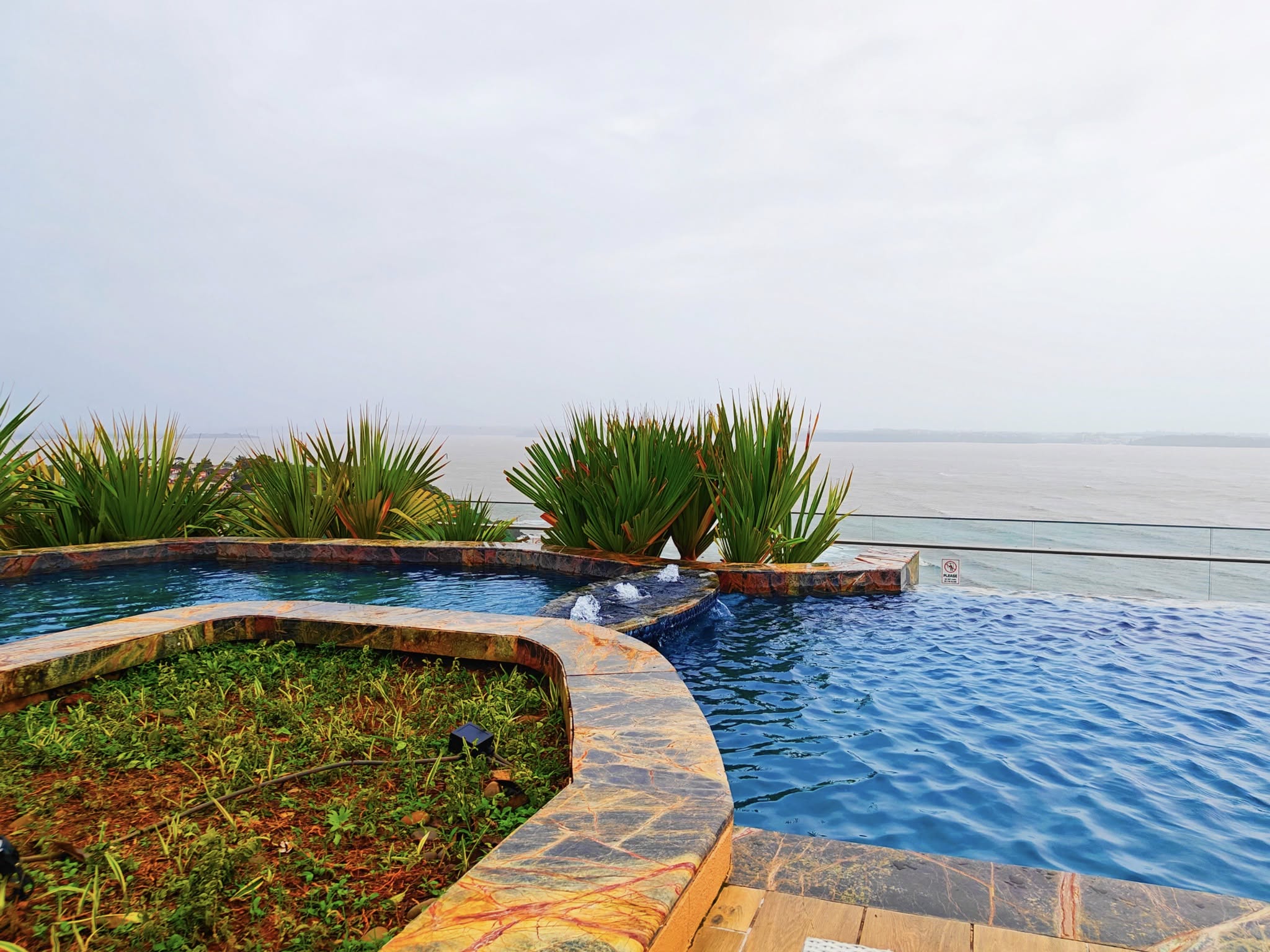 Poolside view at Taj Cidade de Goa Horizon, featuring a stunning infinity pool overlooking the Arabian Sea.