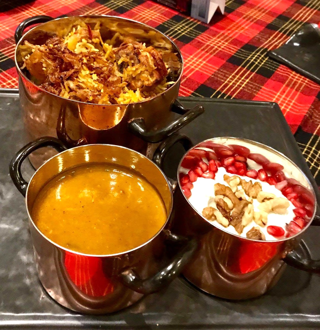 Chicken pulao served with dhansak and lentil dal.