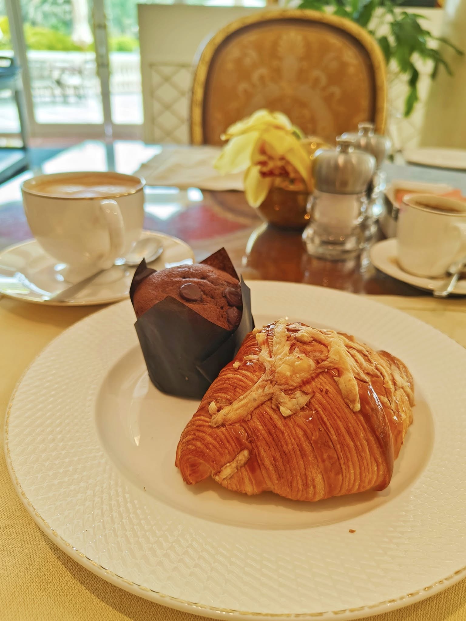Freshly baked pastries and breakfast breads displayed at the buffet in Raffles The Palm, Dubai.