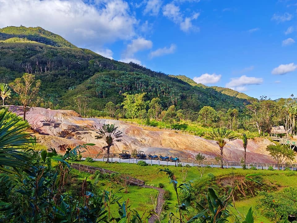 The 23 Coloured Earth formation at Chamarel, Mauritius โ naturally pigmented volcanic soil in a spectrum of reds, browns and purples