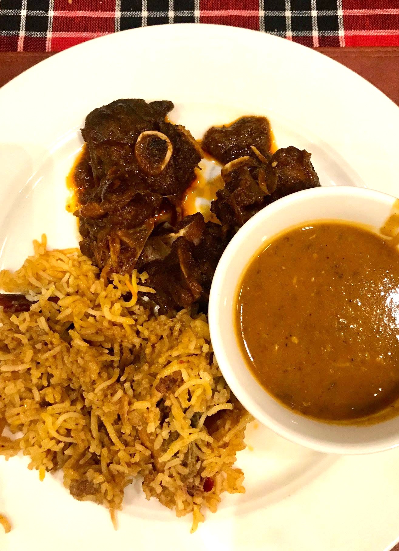 Parsi Dhansak served with brown rice on the side.