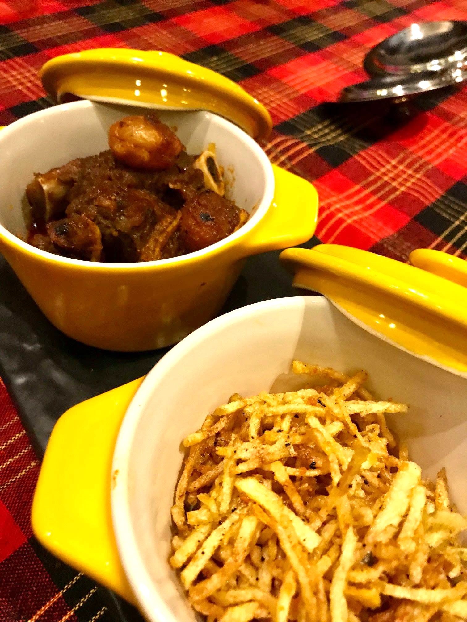 Parsi Jardaloo Salli Ghosht — tender mutton cooked with apricots and topped with crispy potato salli.