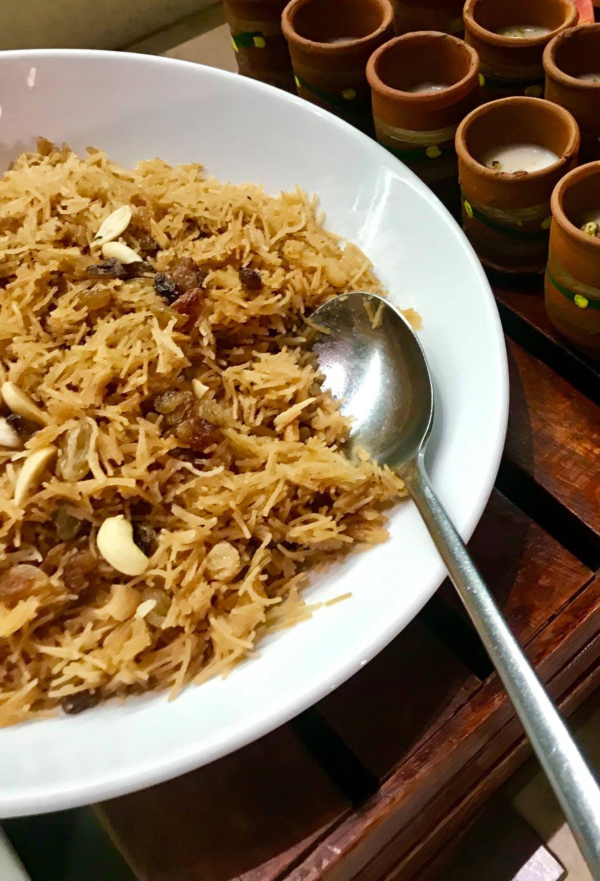Traditional Parsi ravo, a rich semolina pudding garnished with nuts.